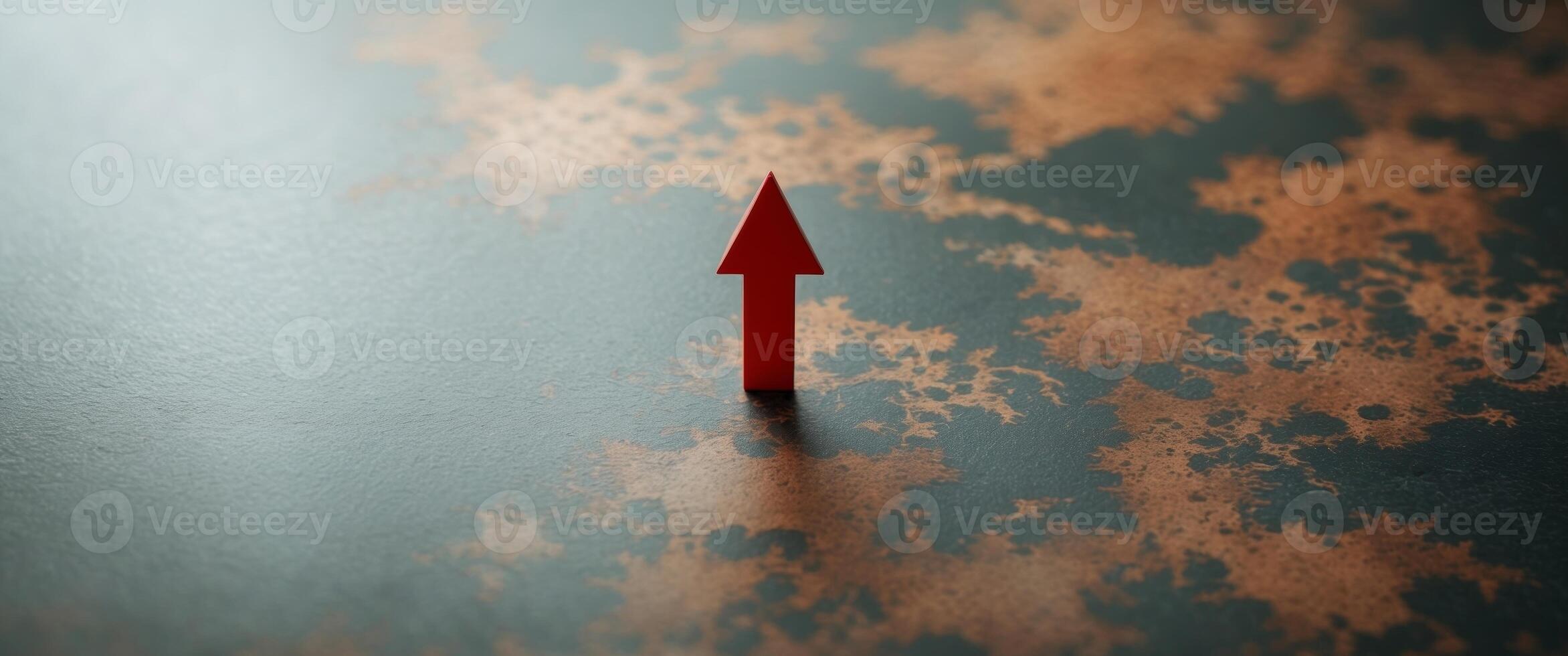 Red Arrow Symbolizing Growth and Progress on Textured Background, Pointing Upward. photo
