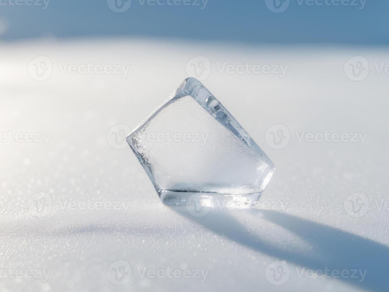 Ice Cube on a Snowy Surface, Abstract Cold Still Life with Shadow and Texture photo