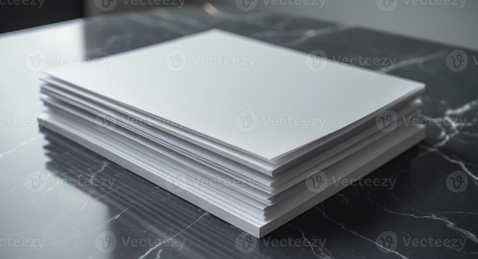 Stack of blank paper on a marble table photo