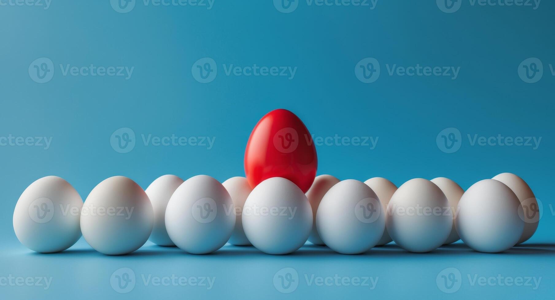 A red egg is standing out from a group of white eggs photo