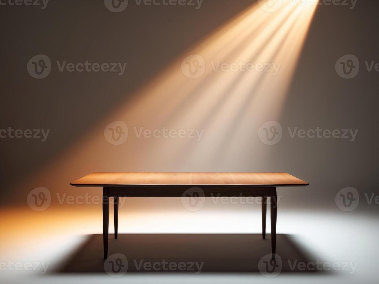 An empty table with light shining down on it photo