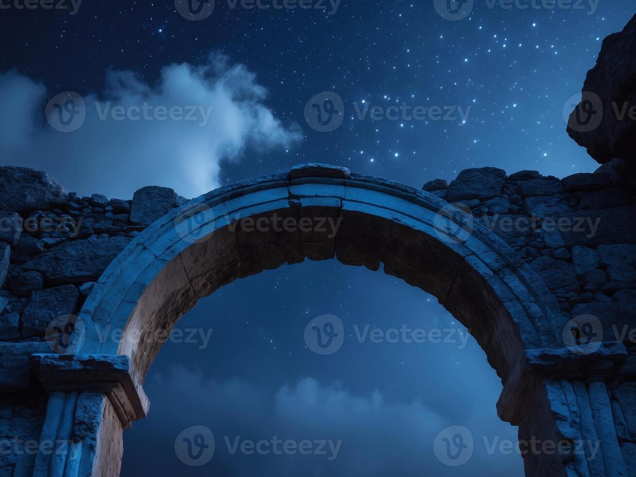 Ancient Stone Archway Framing the Night Sky, Clouds, and Stars, a Journey Through Time. photo