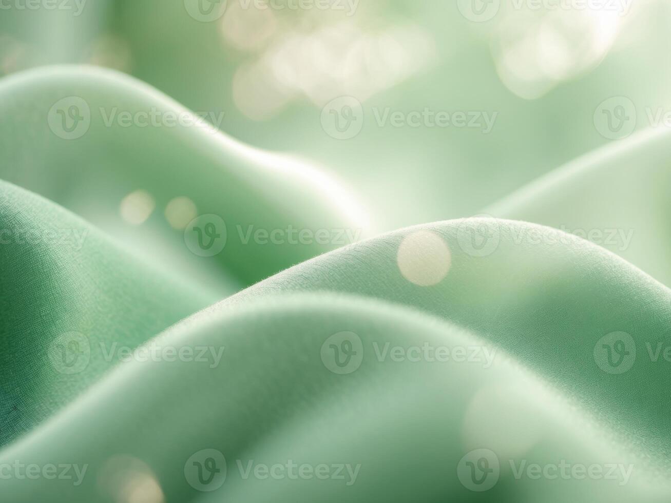 A close up of a green fabric with a bokeh effect photo