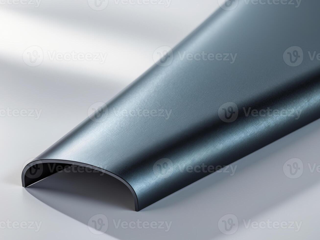 A close up of a piece of metal on a white surface photo
