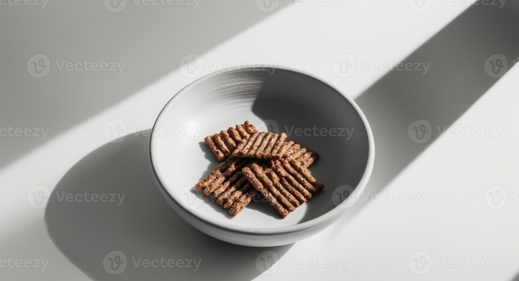 A bowl of crackers on a table photo