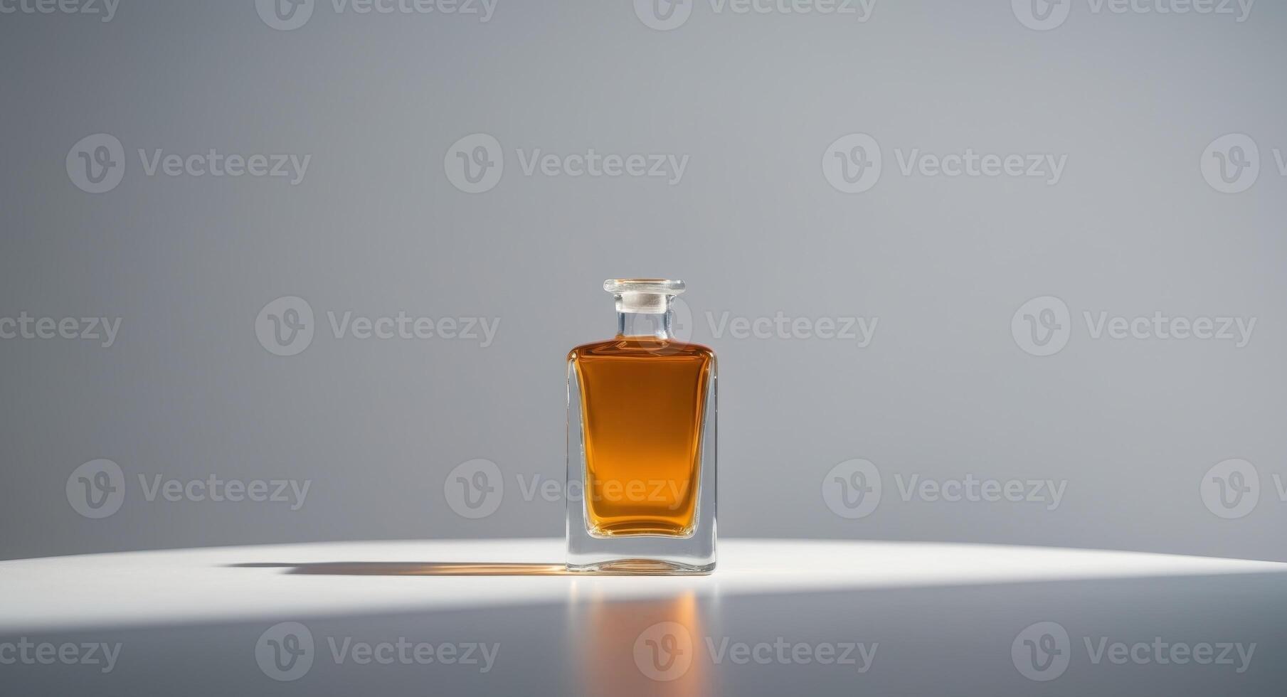 A bottle of whiskey sitting on a table photo