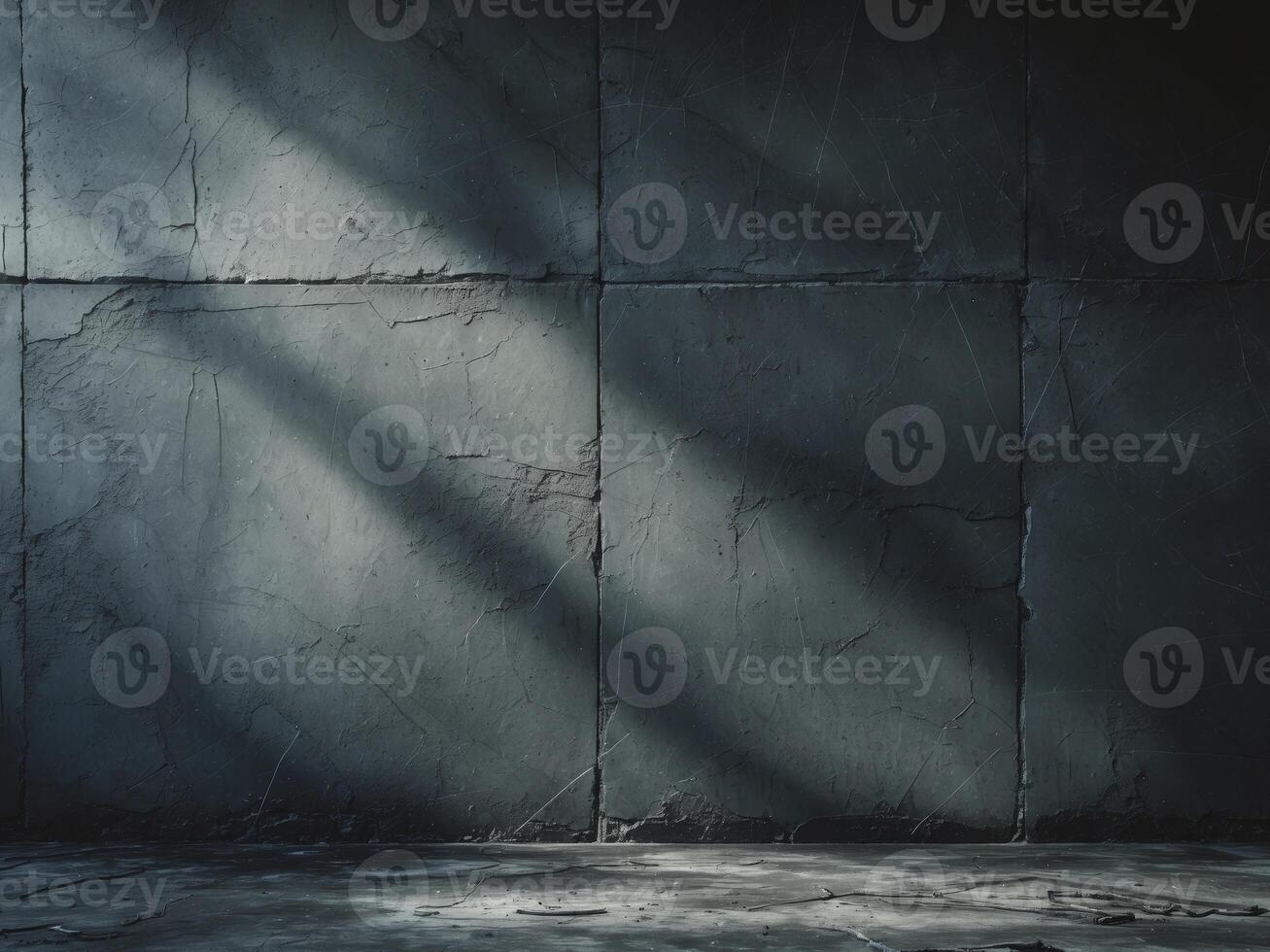 An empty room with a concrete wall and a light coming in photo