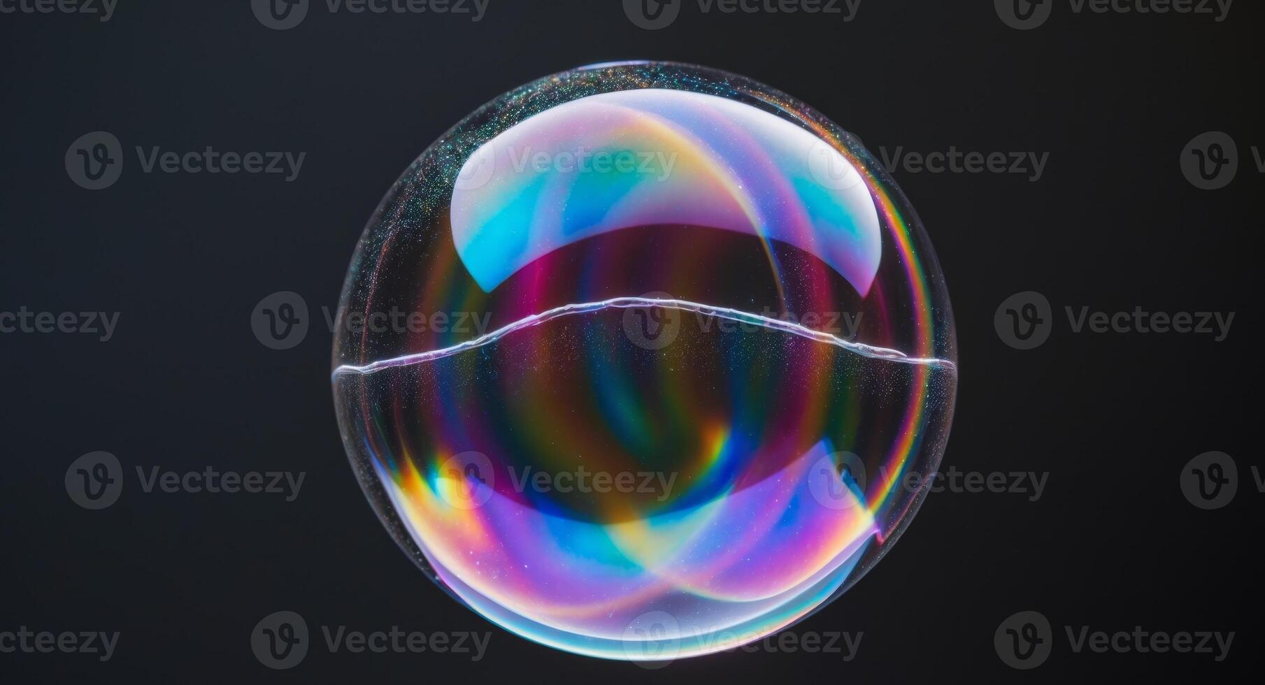 A soap bubble with a rainbow colored reflection photo