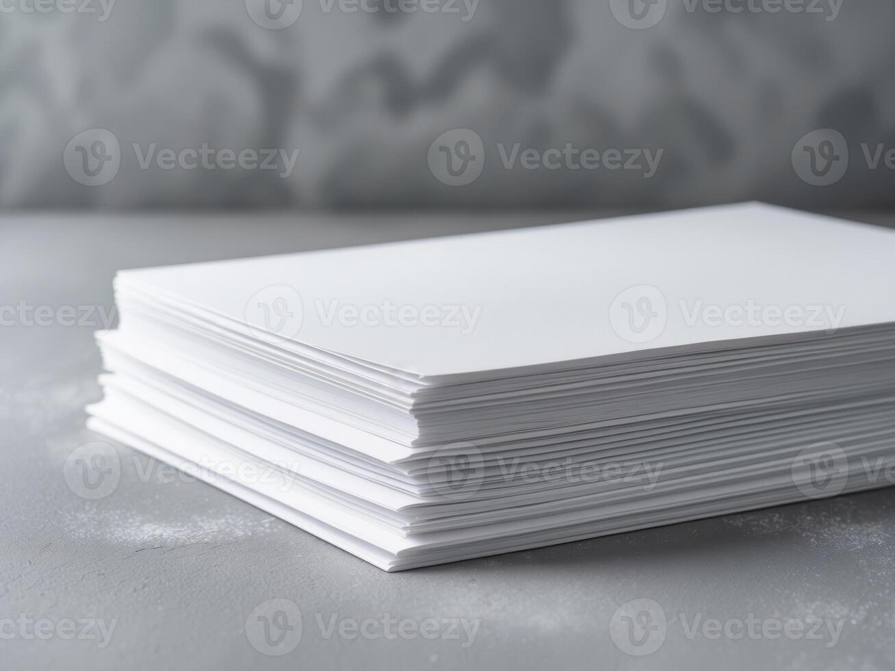Stack of White Paper on a Gray Surface, Ready for Writing and Printing. photo