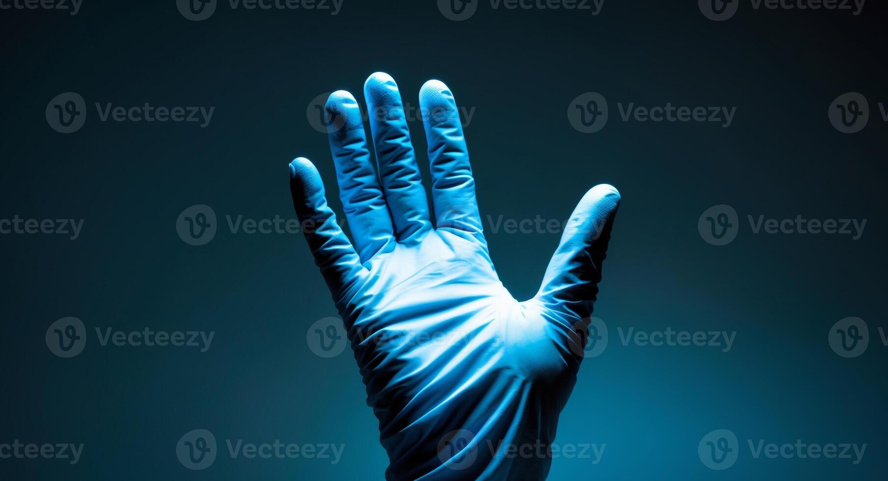 Isolated Hand in Blue Surgical Glove Against Dark Blue Background, Medical Theme. photo