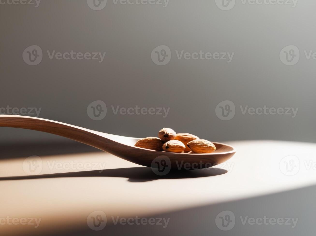 Almonds in a Wooden Spoon Bathed in Light, A Healthy and Natural Still Life. photo