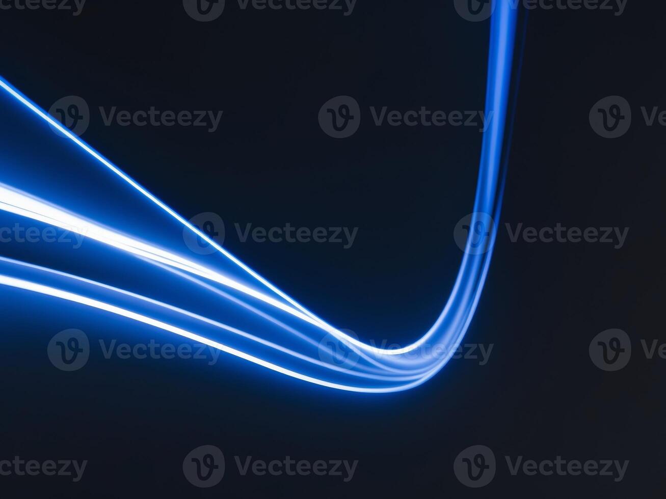 Electric Blue Light Streaks on Dark Background Abstract Movement and Energy. photo