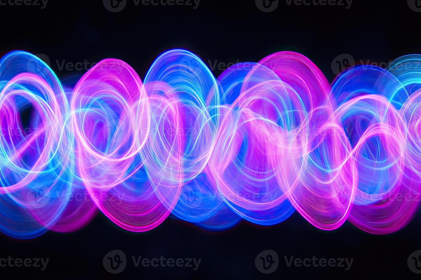 A long exposure photograph of a colorful light pattern photo