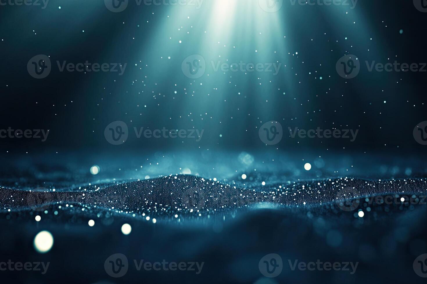 A dark blue background with light shining from the top photo