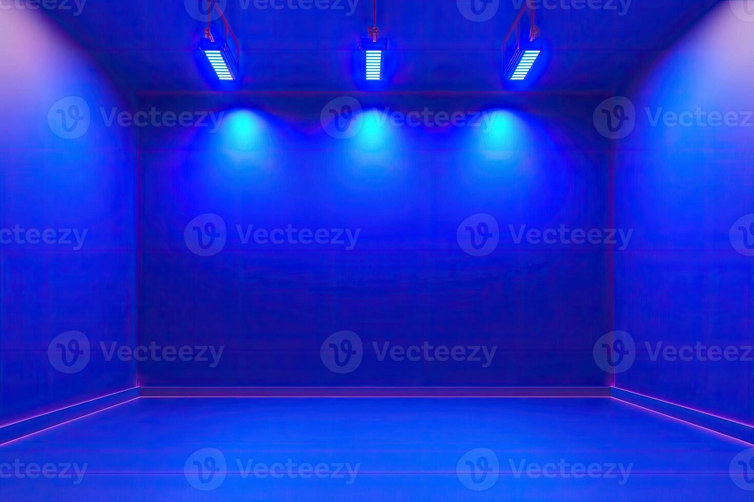 An empty room with blue lights and a wall photo