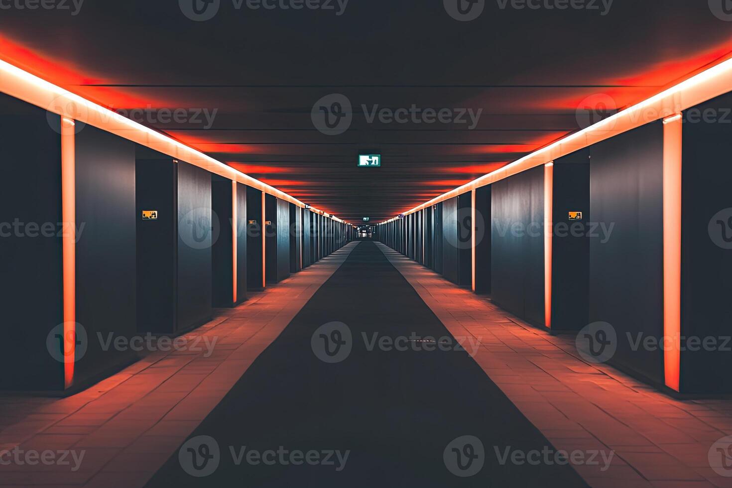 A long hallway with red lights on the ceiling photo