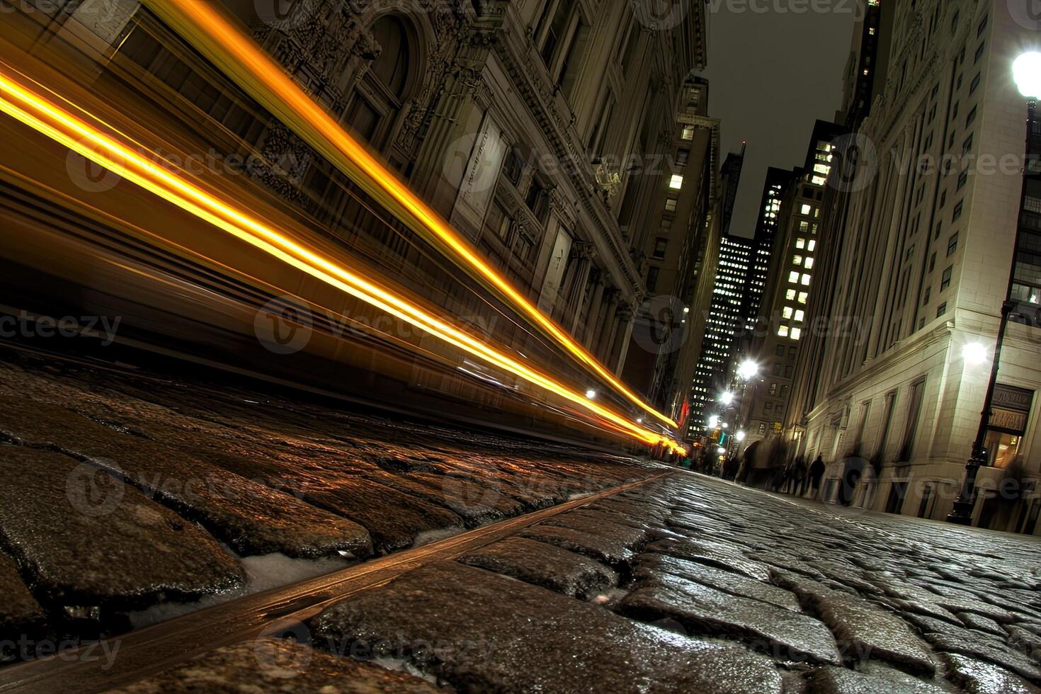 A long exposure photograph of a city street at night photo