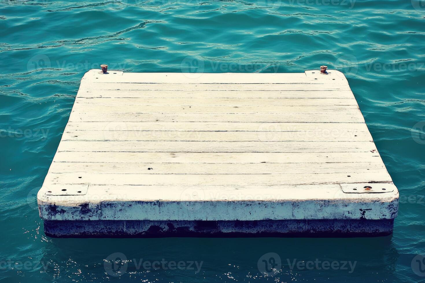A wooden floating dock in the water photo