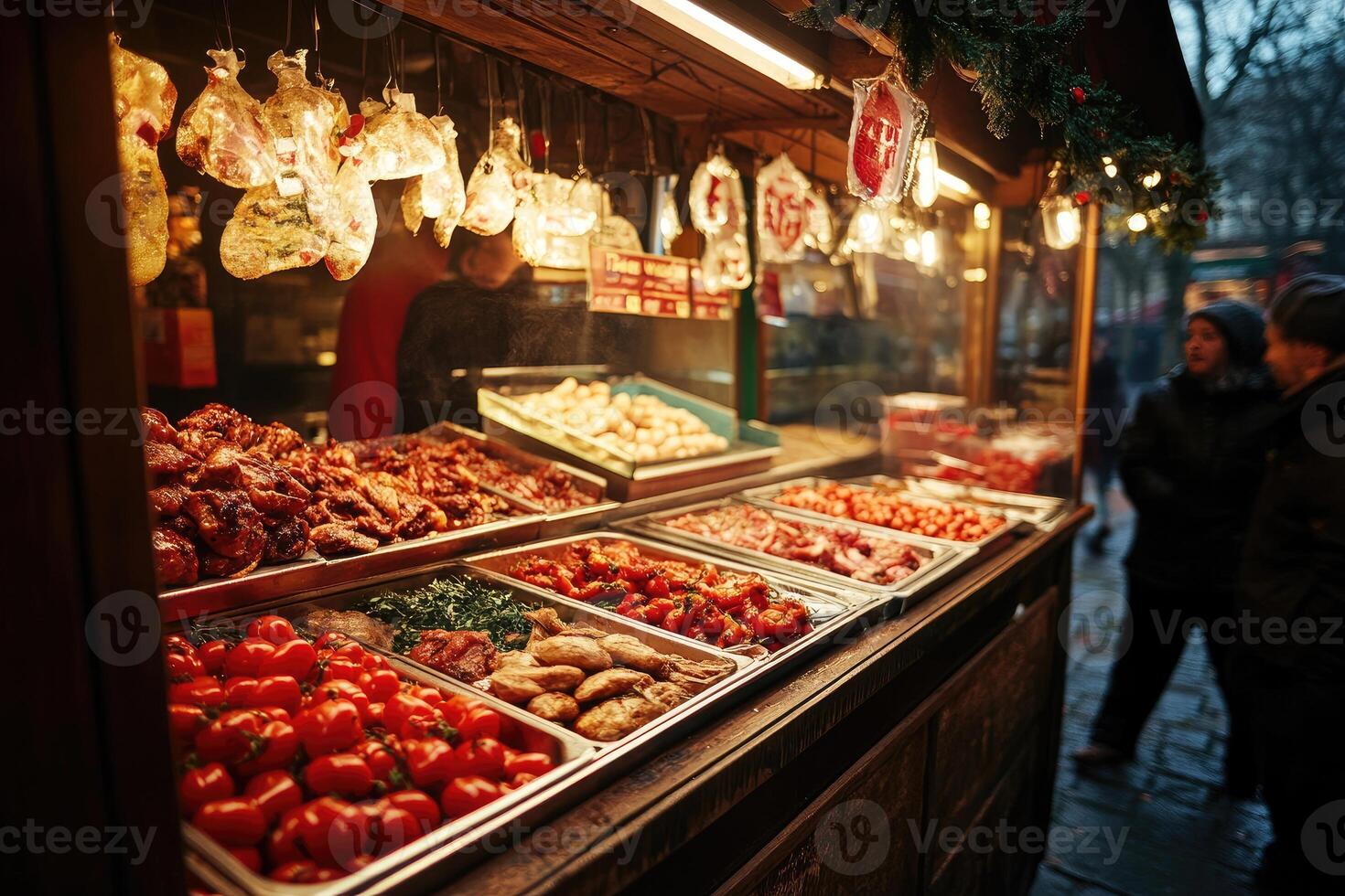 A man is standing in front of a food stand photo