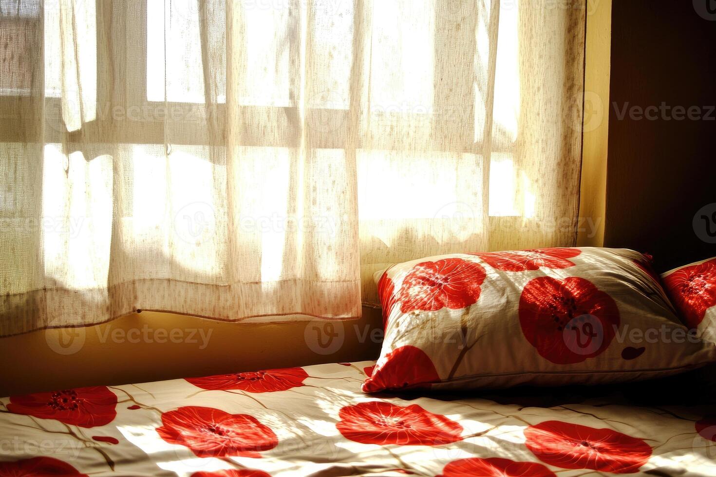 A bed with a red and white floral pattern photo