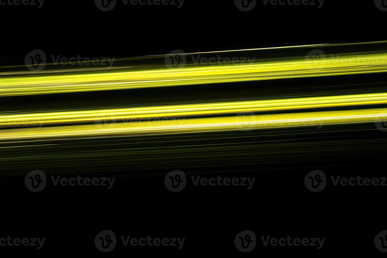 A yellow and black background with a long streak of light photo