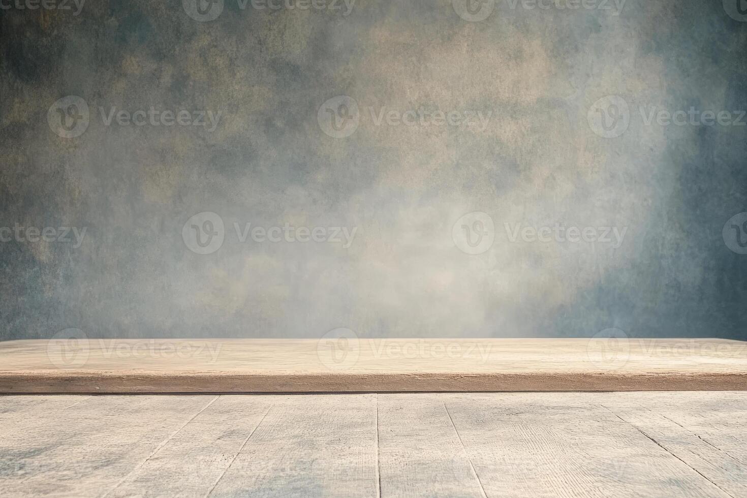 Empty wooden table in front of a blue wall photo