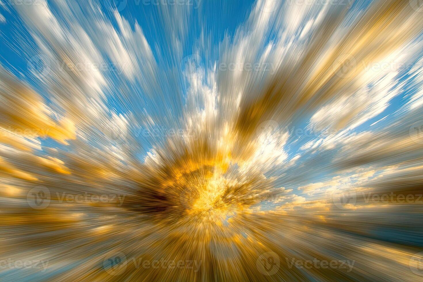 A blurry image of a sunburst with clouds photo