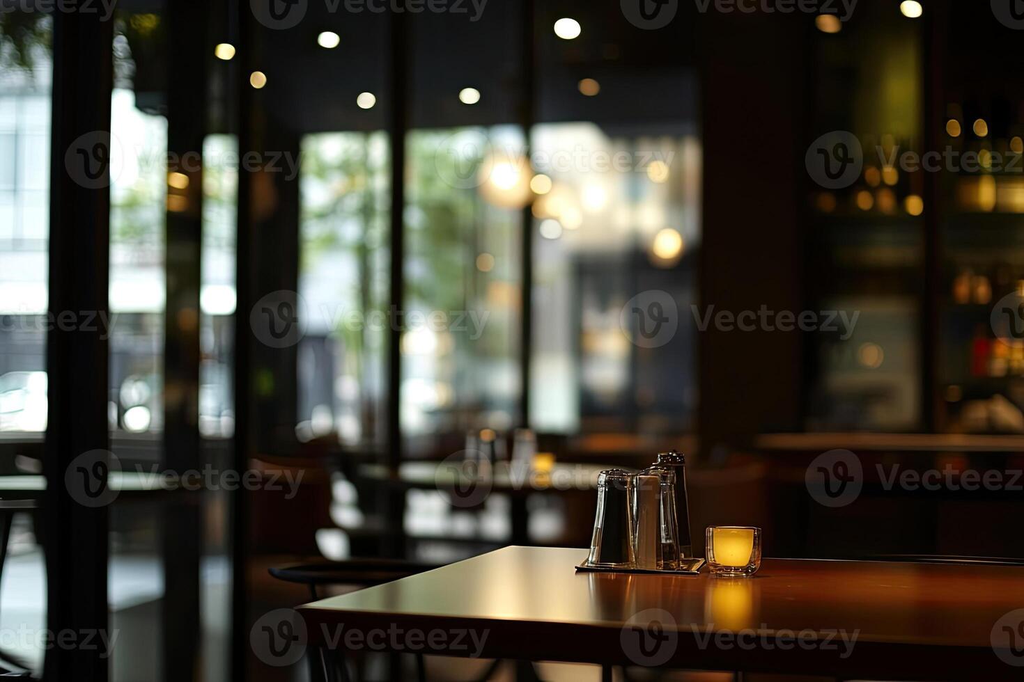 A table with a candle on it in a restaurant photo