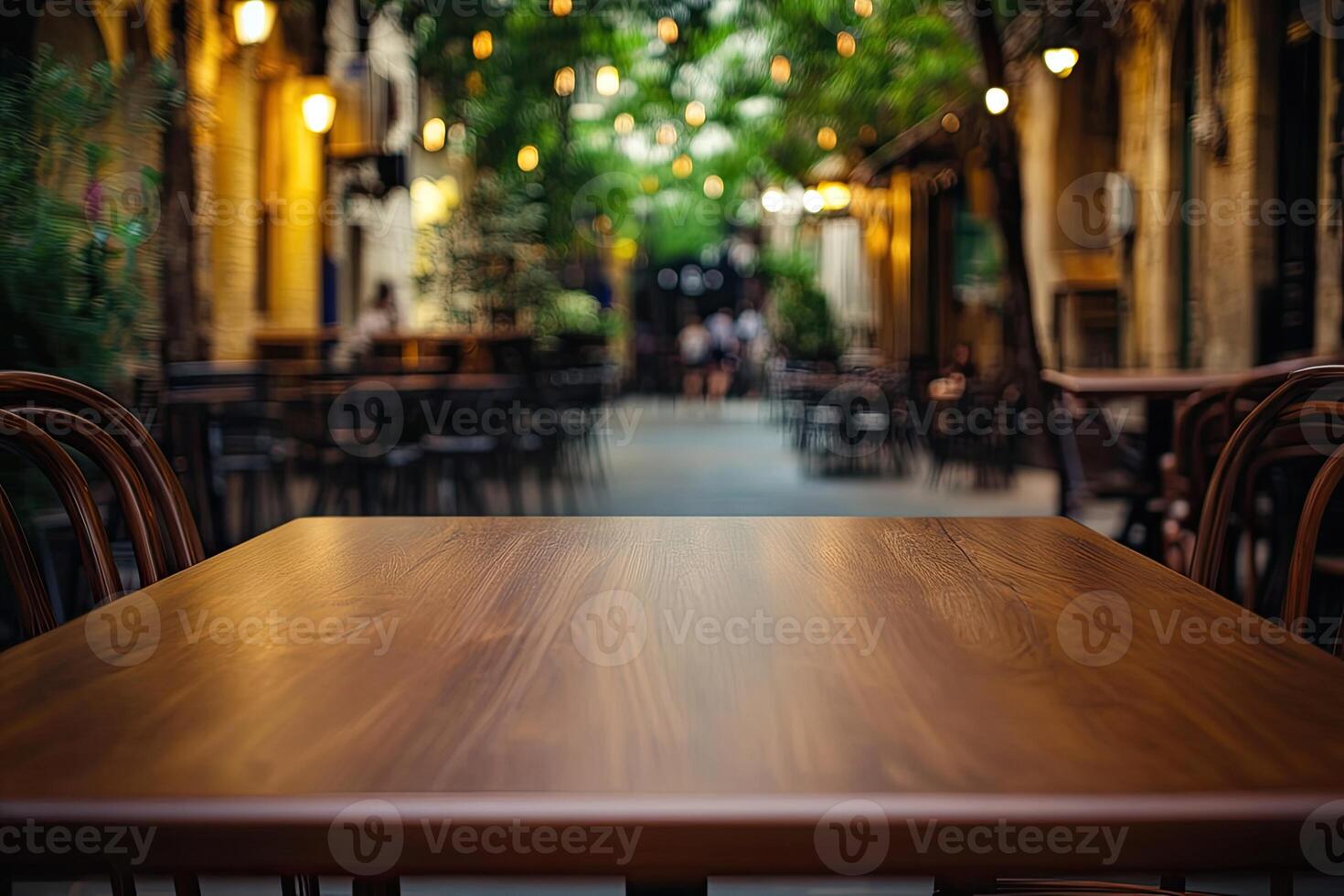 An empty table in a restaurant with chairs photo