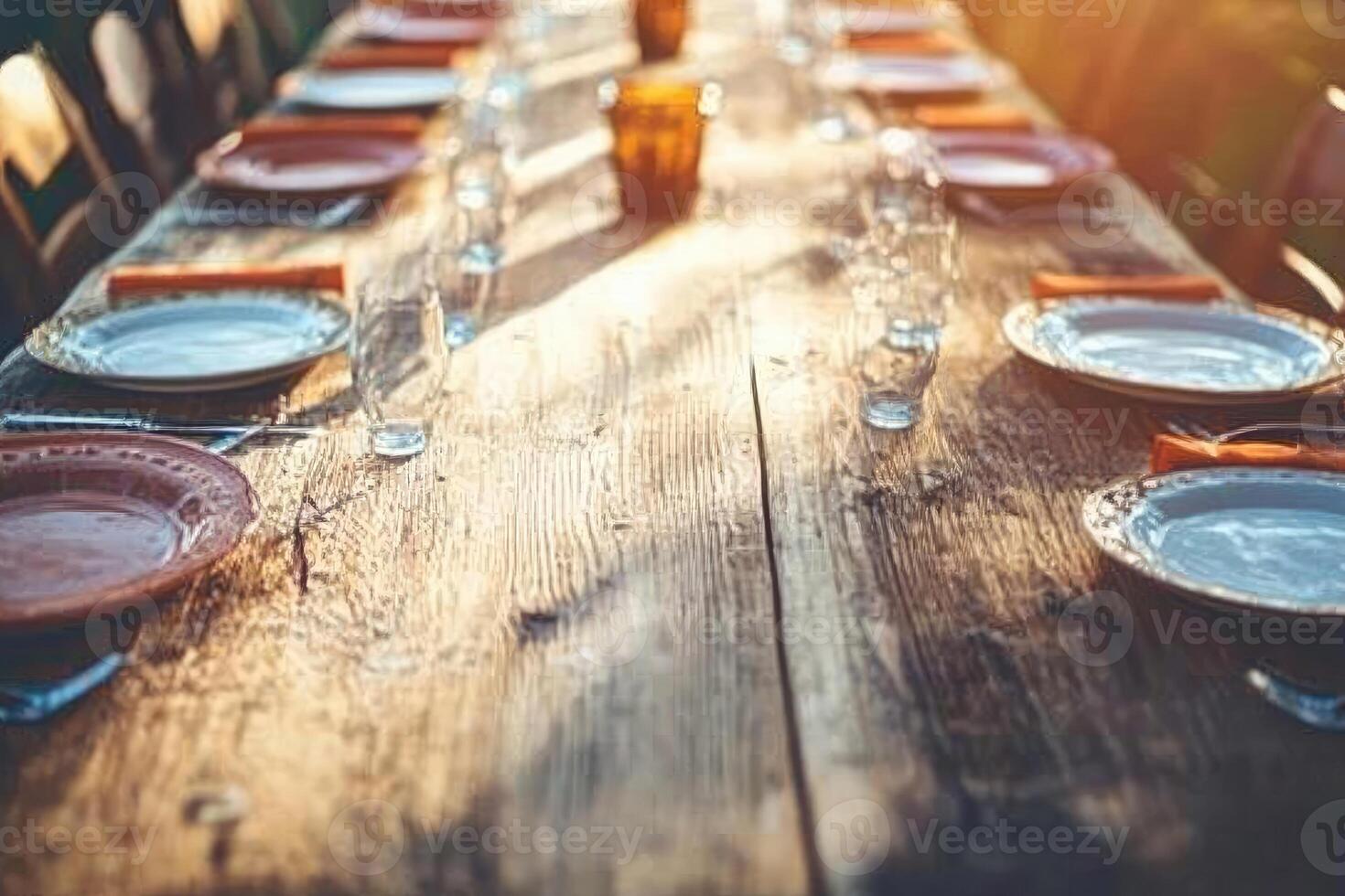A long table with plates and place settings photo