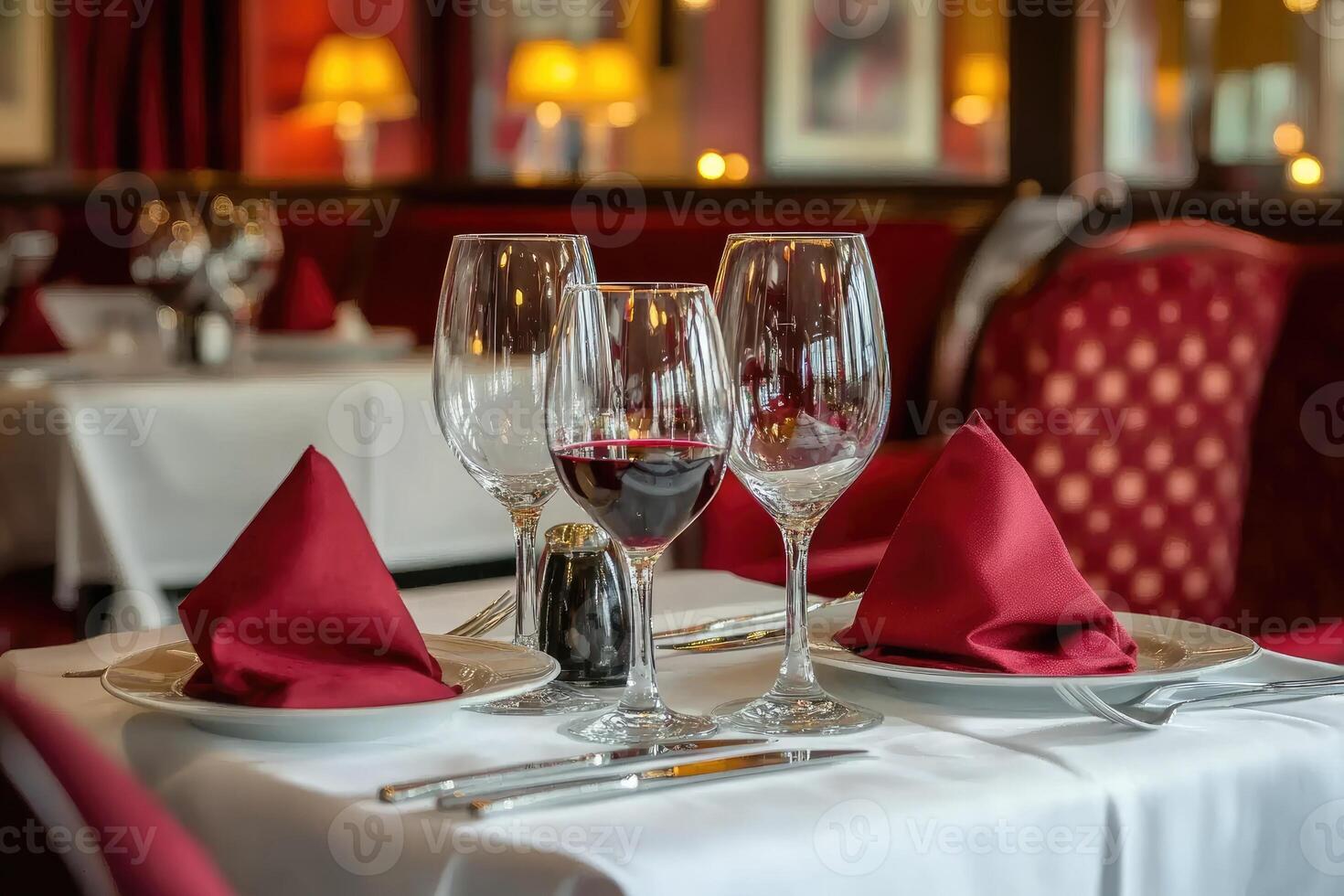 A table with two wine glasses and a napkin photo