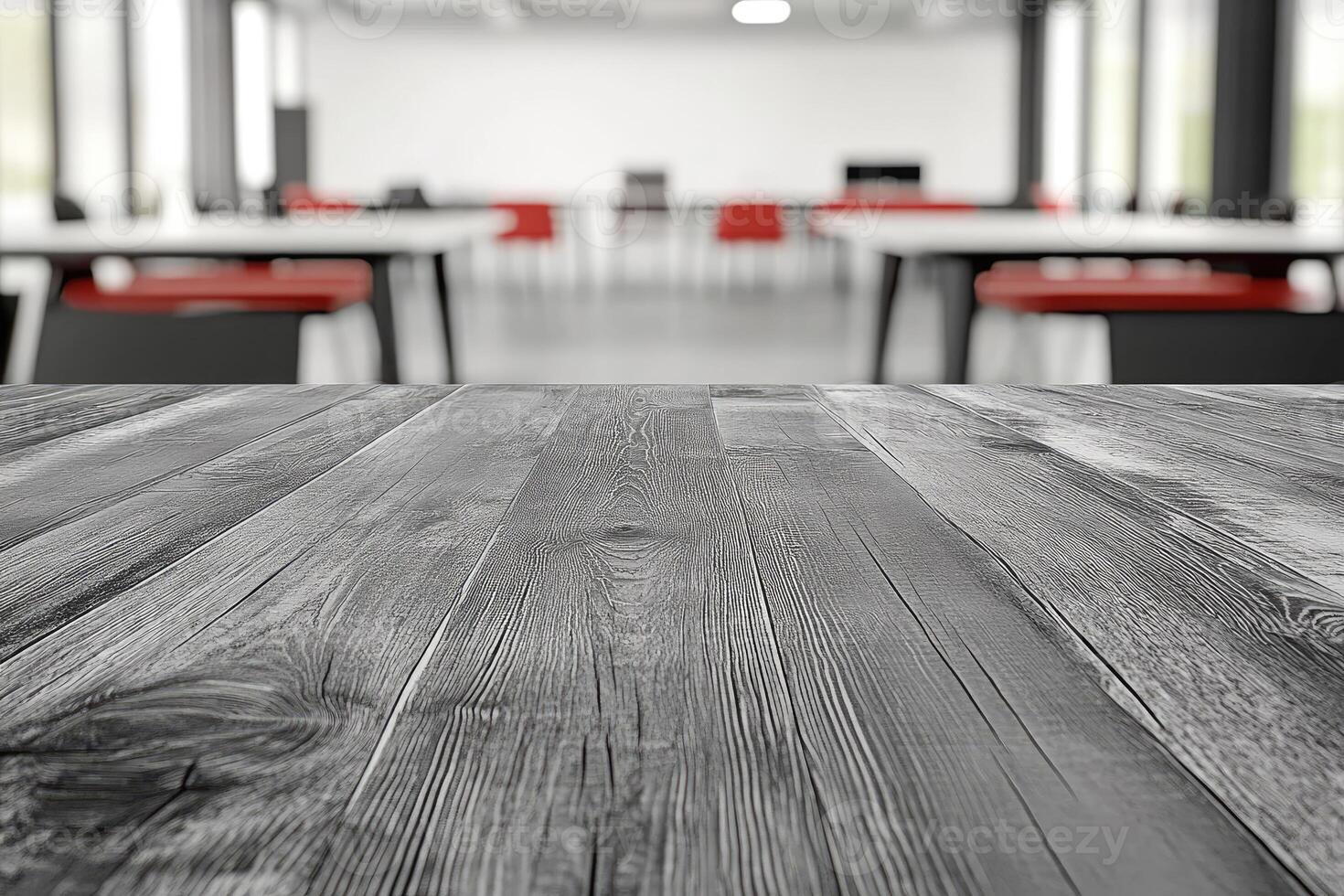 An empty table in a room with chairs and tables photo