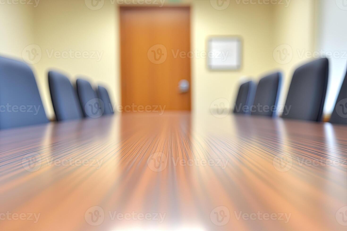 A conference table is shown in a room with chairs photo