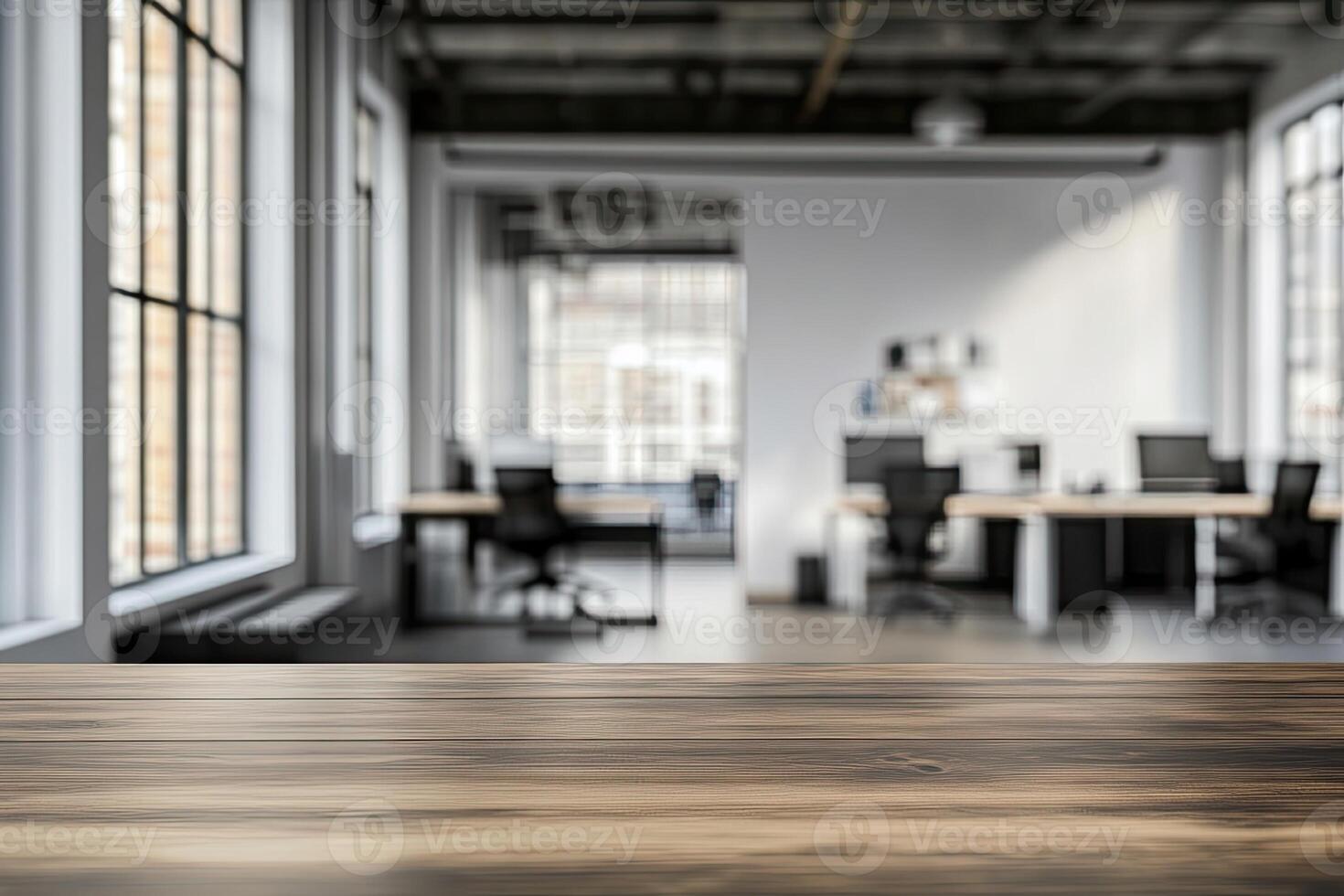 An empty table in an office with a large window photo