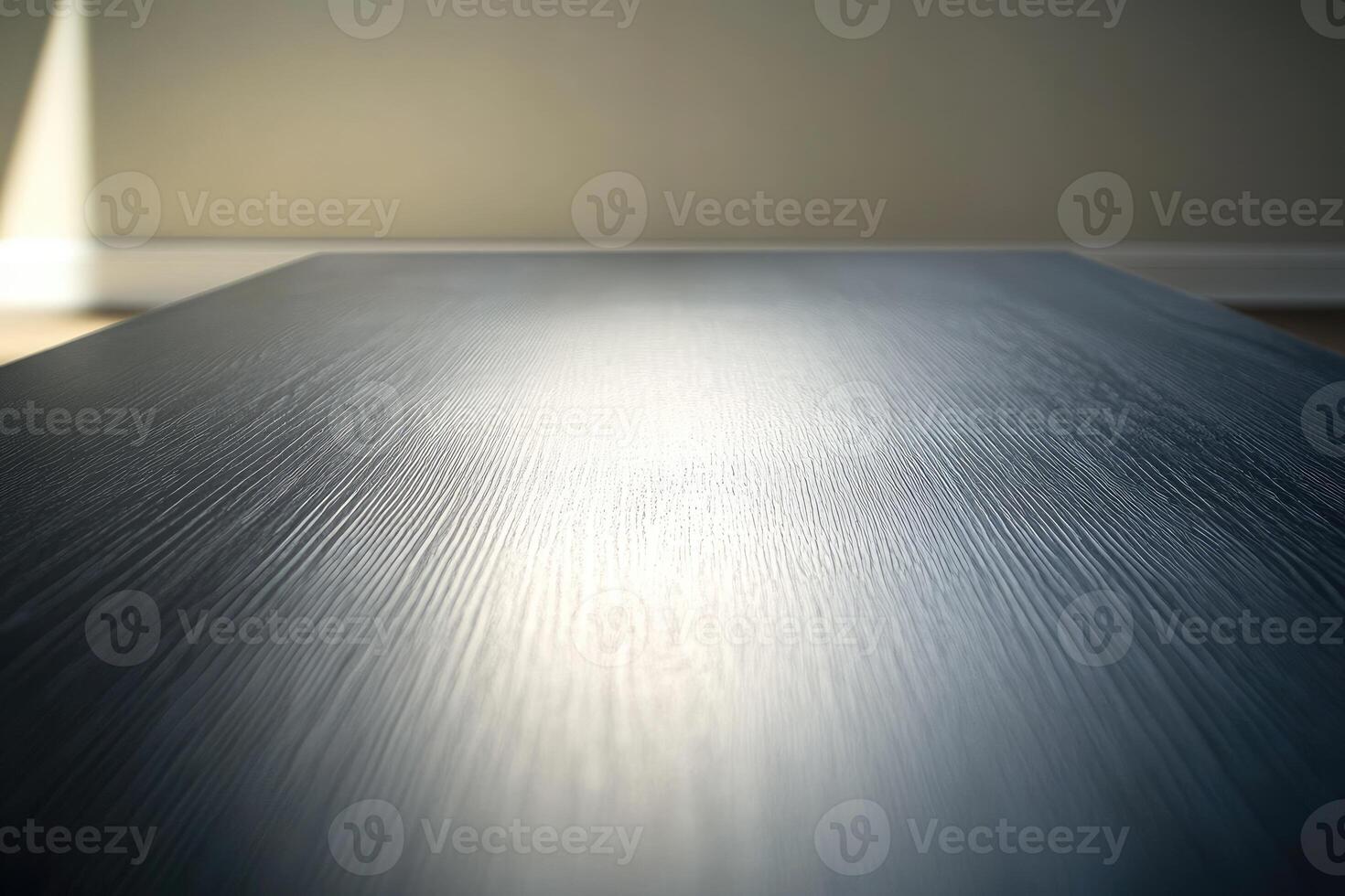 An empty table with a light shining on it photo