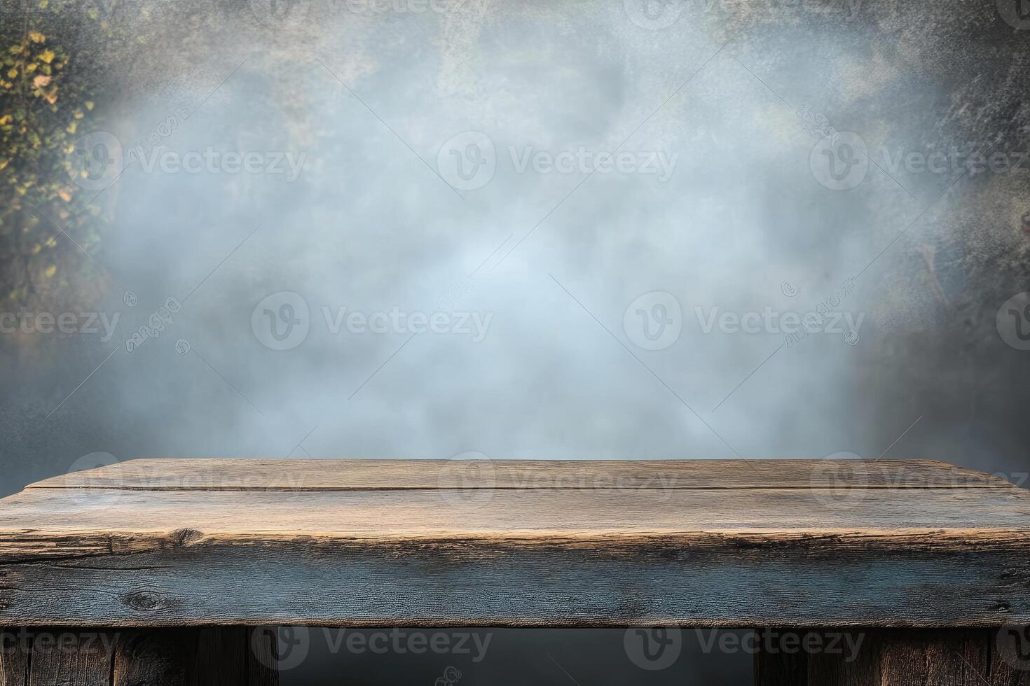 An empty wooden table in front of a dark background photo