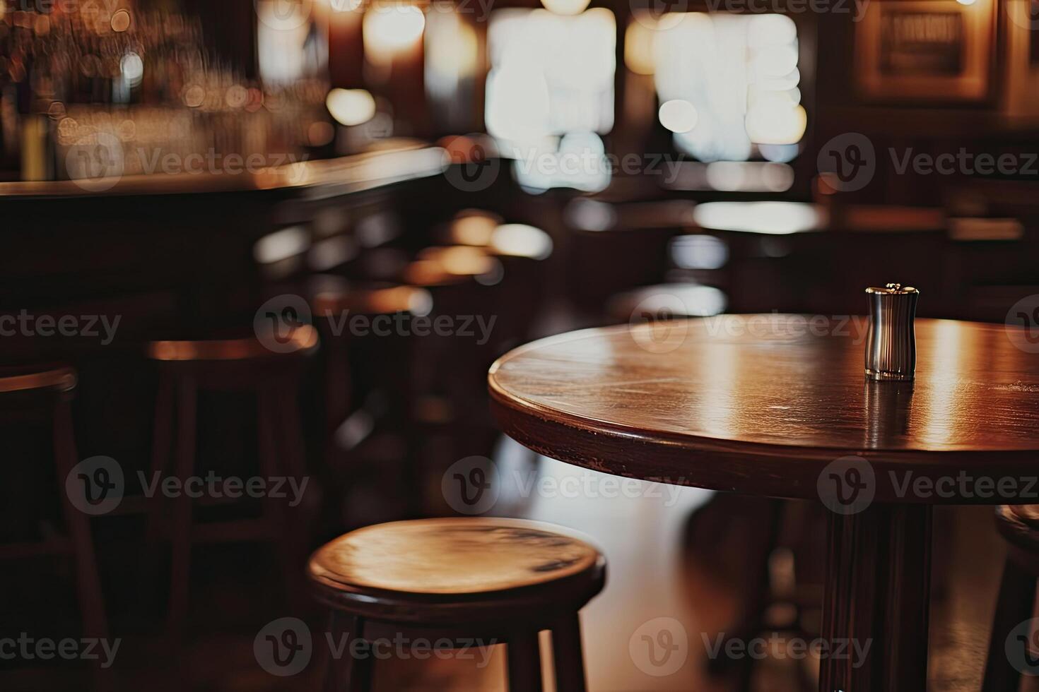 A bar with wooden tables and stools photo