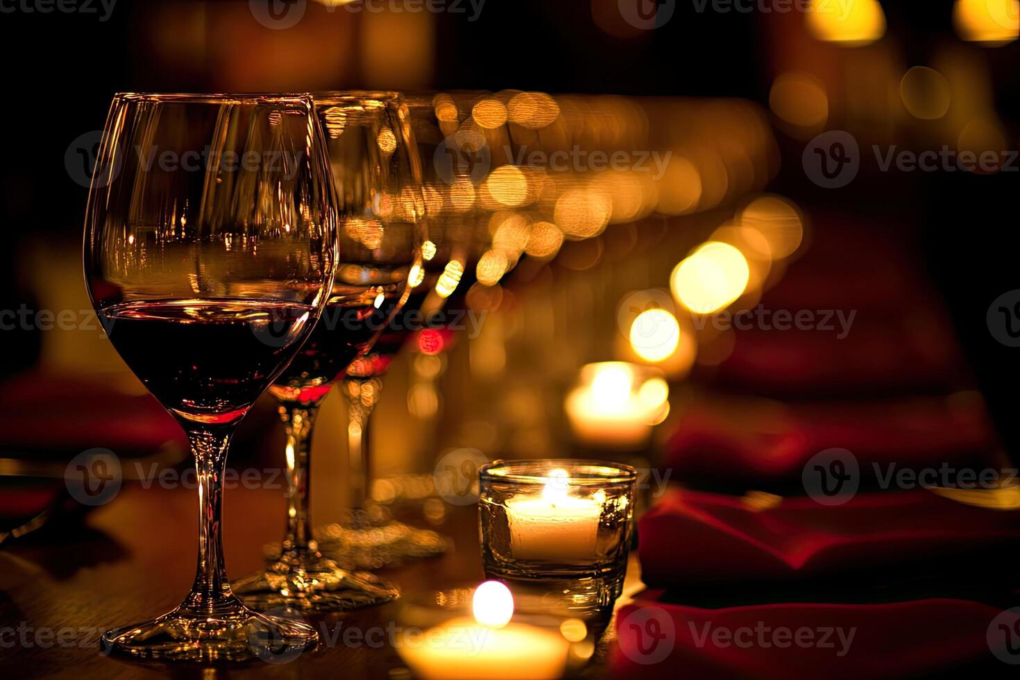 A long table with wine glasses and candles photo