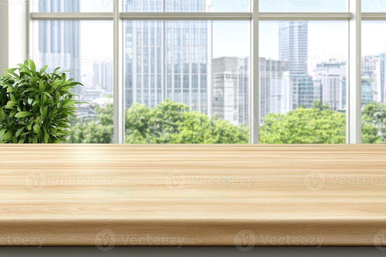 Empty wooden table in front of a window with city view photo