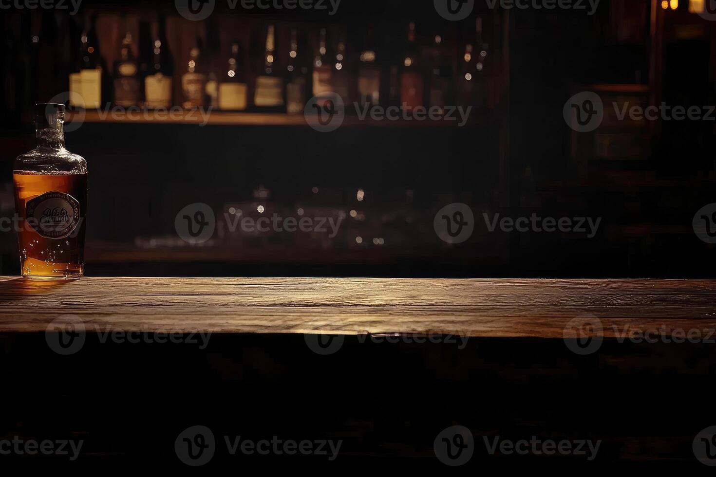 A bottle of whiskey sits on a wooden table photo