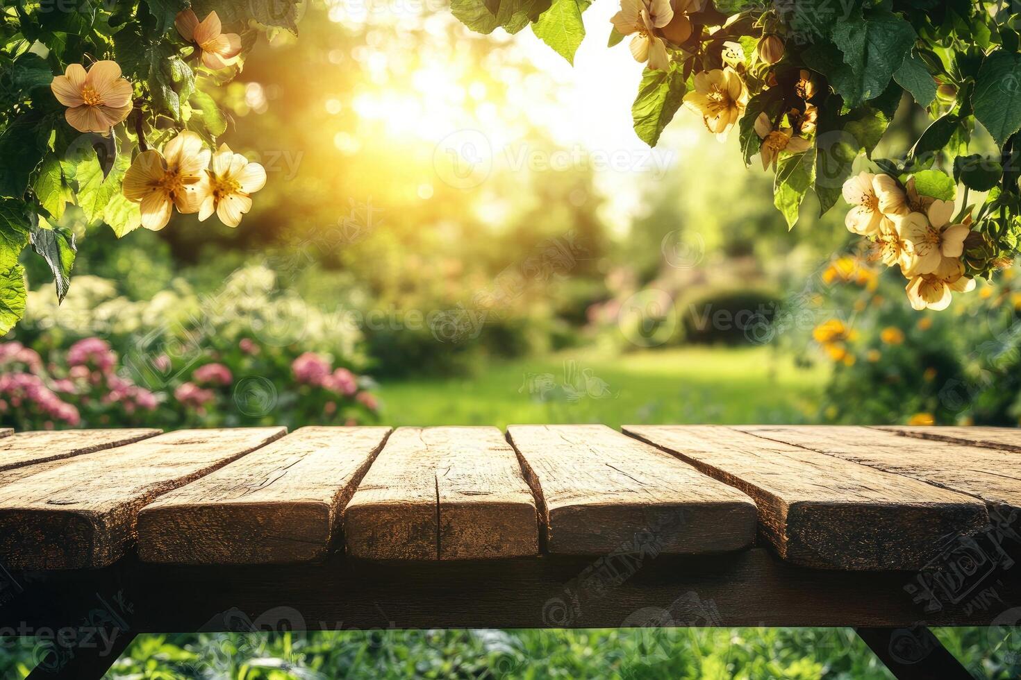 Wooden table in the garden with sun shining through the trees photo
