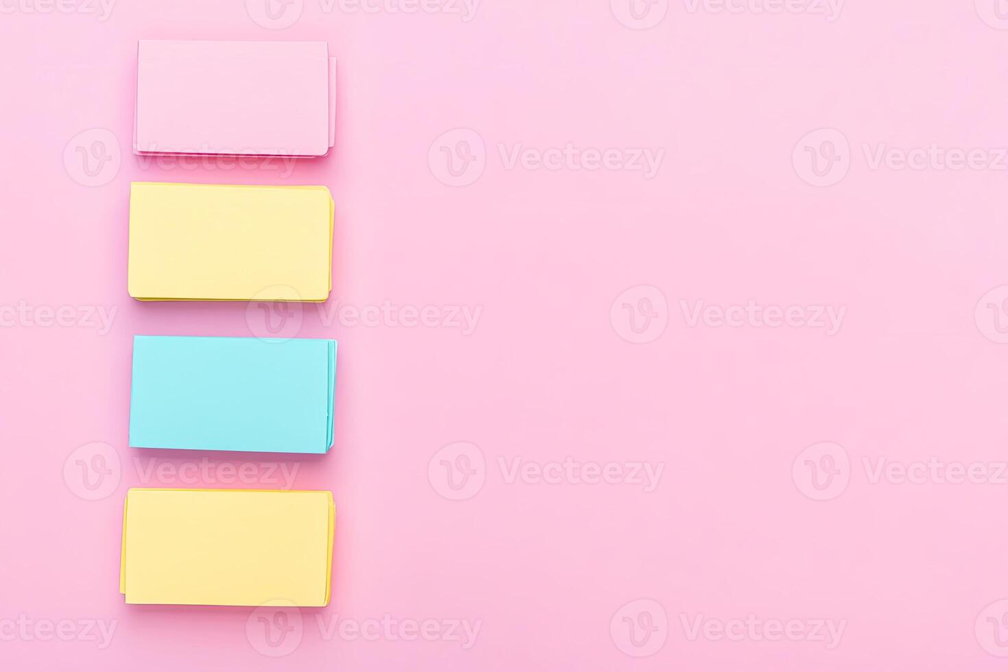 Three colorful sticky notes on a pink background photo