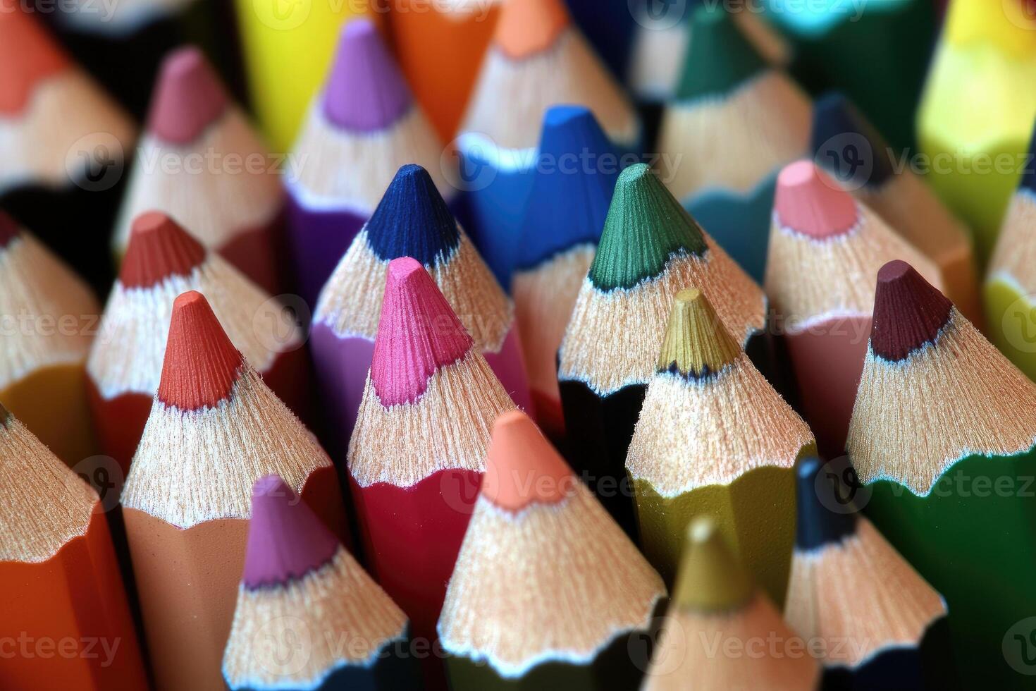 Many colored pencils are arranged in a row photo