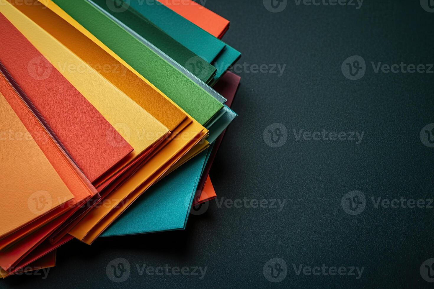 Colorful paper on black background photo
