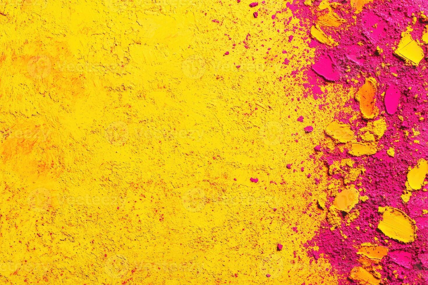 Colorful holi powder on a yellow background photo