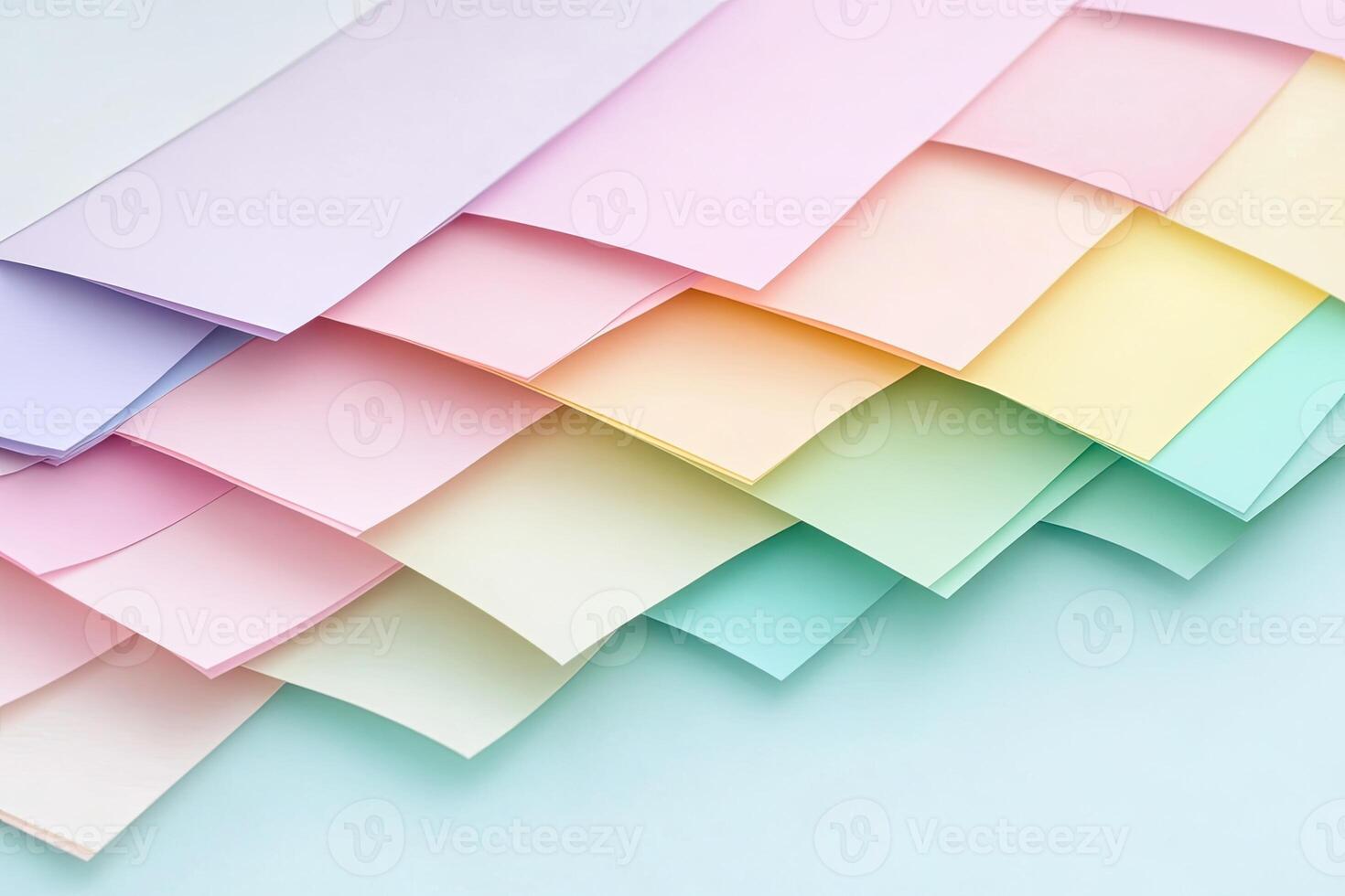 A pile of colorful paper sheets on a blue background photo