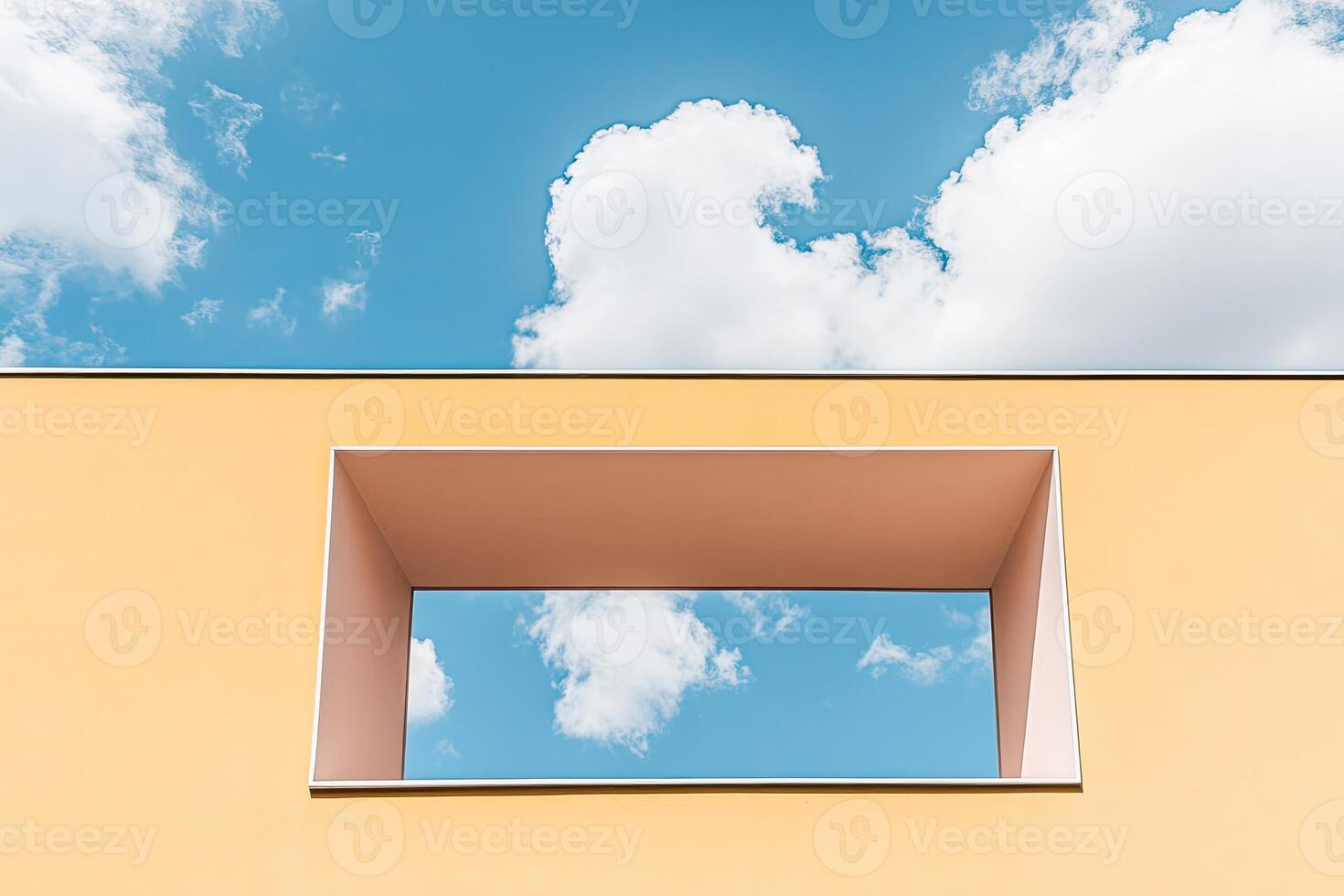 A square window in a yellow building photo