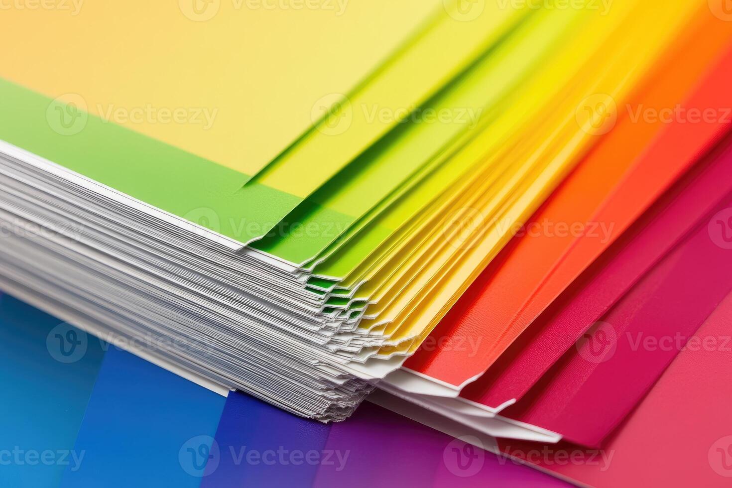 A stack of colorful paper with a rainbow pattern photo