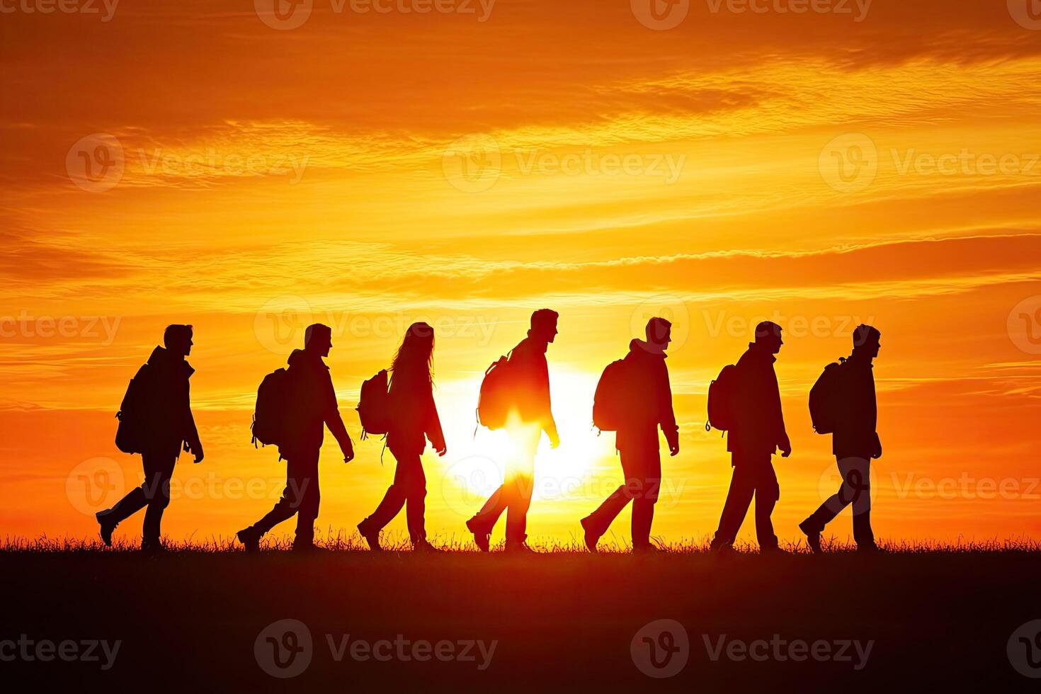 Hiking group at sunset photo