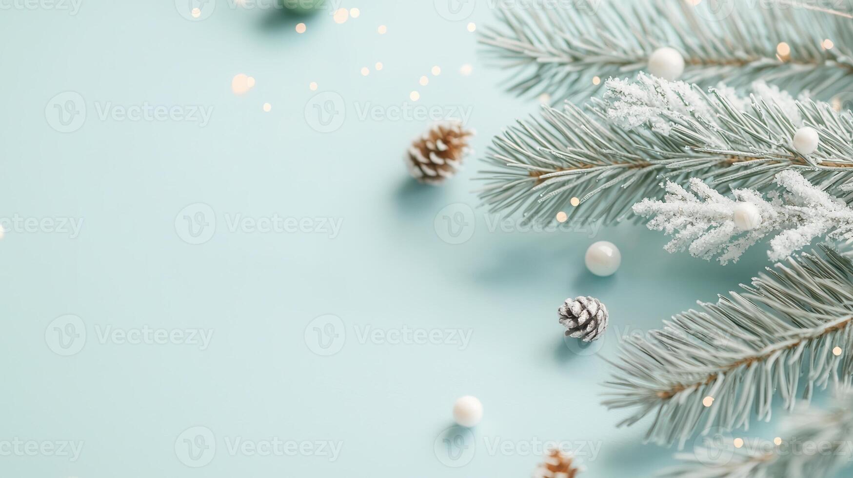 Christmas winter decoration with frosted pine cones and copy tree branches on light blue background with fir space photo